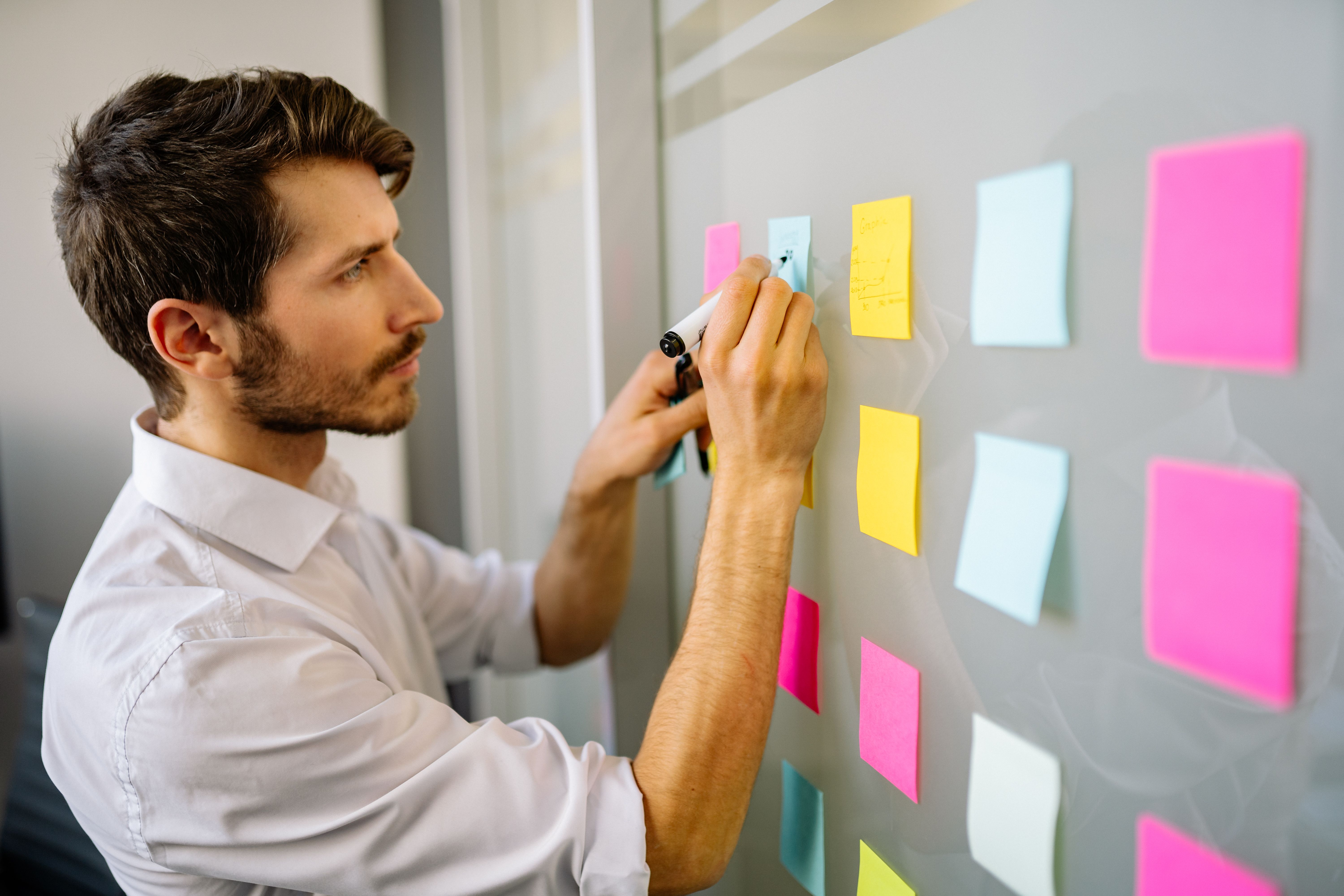Printed storyboard sheets with color tabs on a planning table